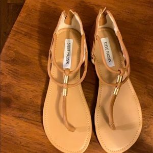 Brown sandals with gold accents